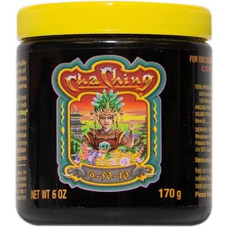 A container of Cha Ching fertilizer with a label showing the product name and an illustration of a plant with fruits.