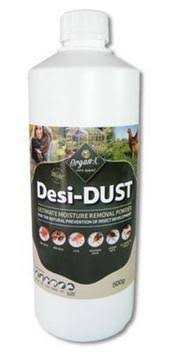 A white bottle labeled 'Desi-DUST' with text and images indicating its use for moisture removal and pest control on poultry.